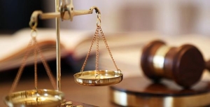 Photo showing the scales of justice and a gavel to represent equal access to justice